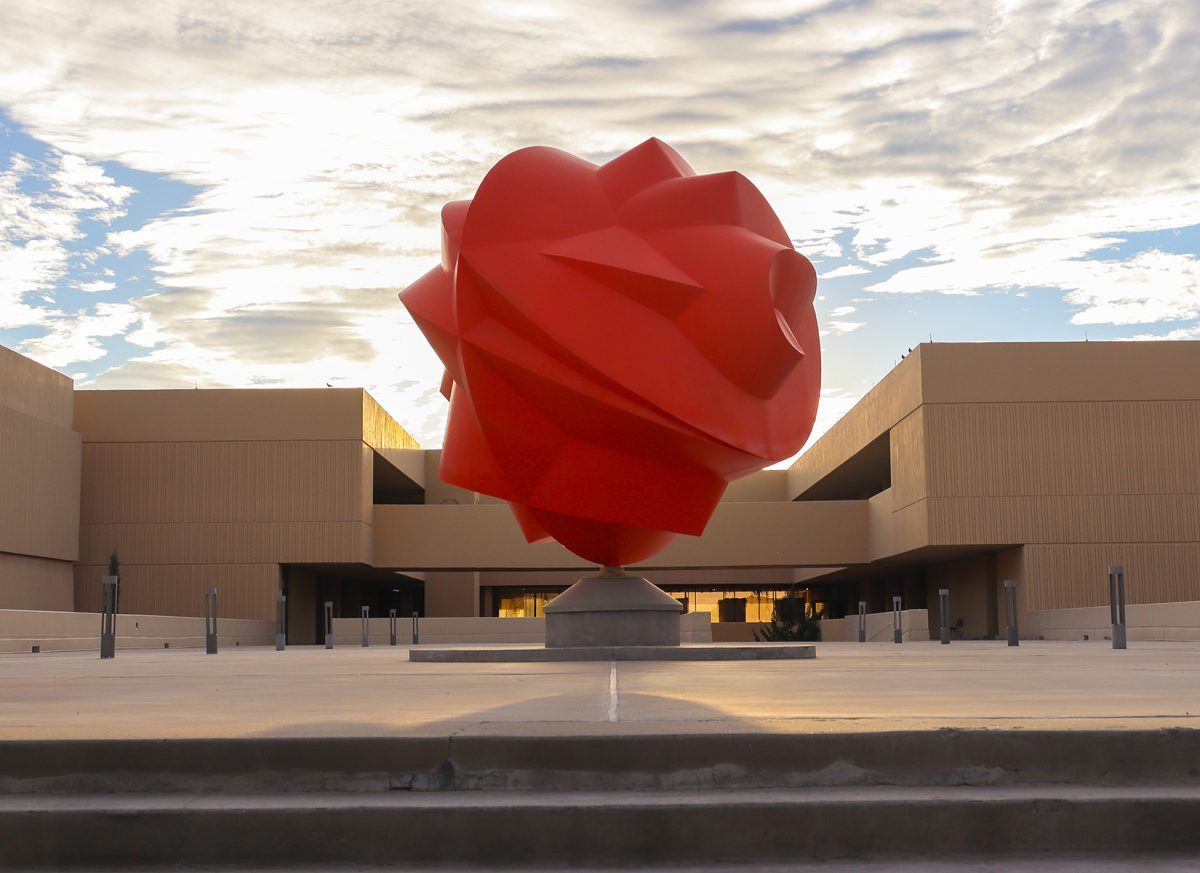 Upcoming Projects, huge, orange outdoor sculpture that looks like a heart in front of the UTEP Fox Fine Arts Complex